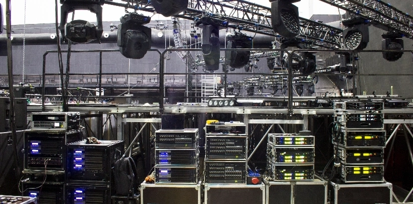 A large room showcasing multiple big speakers and sound equipment