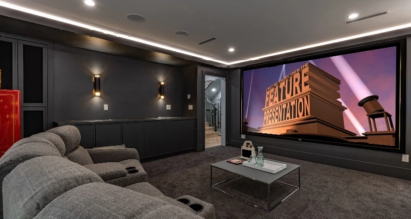 A stylish home theater setup with a projector screen