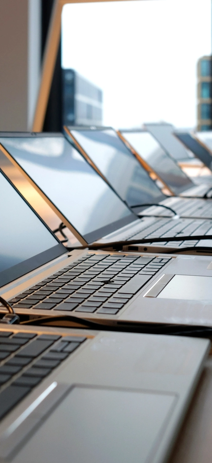 Several laptops positioned on a table